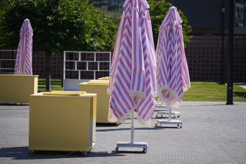 Colorful umbrellas and vendor stands in urban park