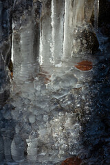 Intimate sunshine illuminating icicles on a cliff in Bolton, Connecticut.
