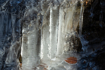 Intimate sunshine illuminating icicles on a cliff in Bolton, Connecticut.
