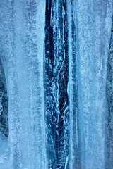 Tall ice formations with notches, on a cliff in Connecticut.