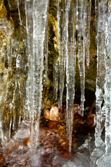 Icicles draped over a cove in a cliff in Connecticut.