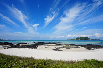 fine sea view with sand beach and charming clouds