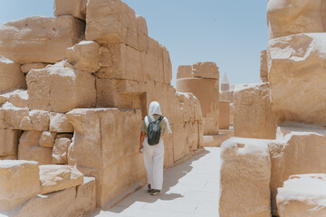 Tourist walking in karnak temple on sunny day