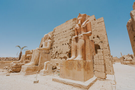 Majestic statues guarding the entrance of the ramesseum temple in luxor