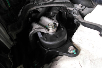 Engine mount or motor mount close-up, engine vibration damper, car part for auto repair, vehicle maintenance.