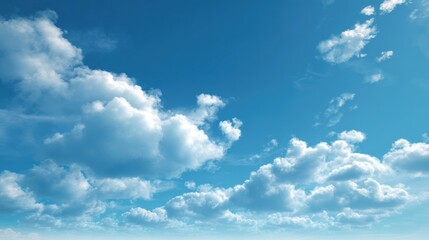 Obraz premium A stunning clear sky filled with fluffy white clouds that create a serene and peaceful atmosphere.