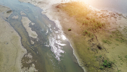 River running through drought-parched land