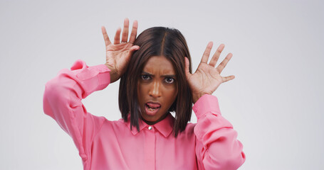 Portrait, funny face and woman in studio with goofy expression isolated on white background space....