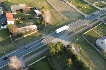 White delivery truck driving near city area