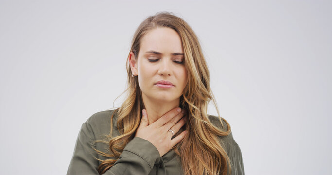 Health, sick and woman with sore throat in studio from viral infection, discomfort and acid reflux. Mockup space, person and swollen gland on white background with swallow difficulty and inflammation