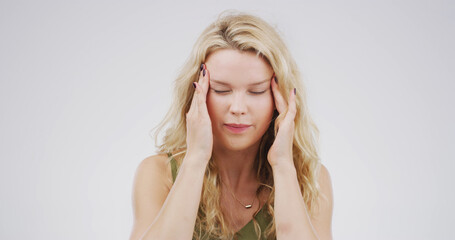 Headache, pain and woman in studio, stress and frustrated with brain fog on white background....