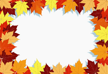 Autumn leaves border framing blank space on blue background  