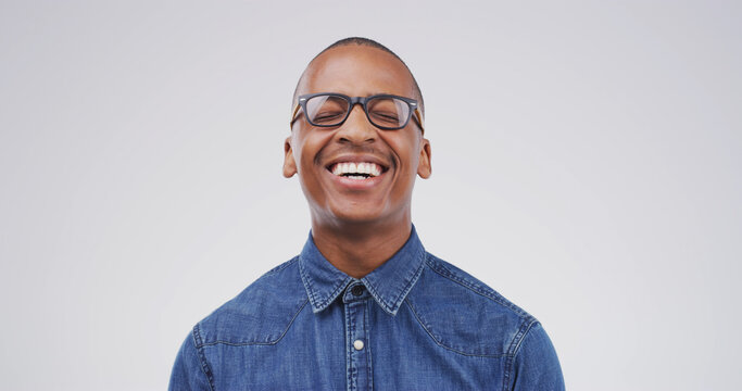 Happy black man, studio and laughing at joke, comedy and excited isolated on white background. LOL, smile and African person with funny story, silly and comic expression for euphoria with space