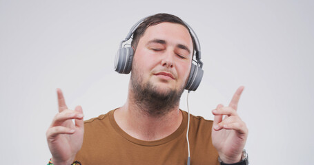 Headphones, relax and man in studio with music, playlist or gospel radio for praise and worship....