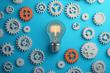 An illustration of a lightbulb surrounded by gears, representing the innovation and ideation process inherent in business development
