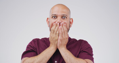 Surprise, shock and portrait of scared man with fear, mind blown or terror on white studio...