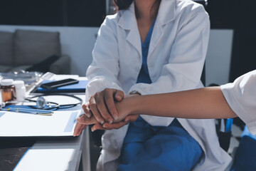 The doctor is checking and encouraging the patient.