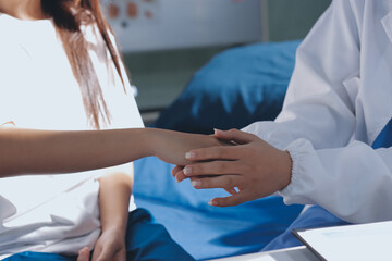 The doctor is checking and encouraging the patient.