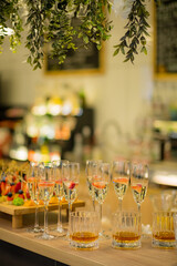 Glasses filled with sparkling beverages and colorful appetizers adorn the festive gathering