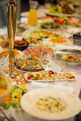 A festive table displays a vibrant array of dishes and drinks, ideal for celebrations