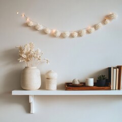 Cozy home decor with vase, dried flowers, books, and string lights