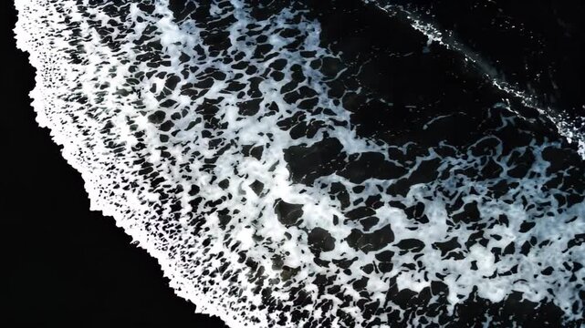 surfers are riding the waves on the black sand of the beach