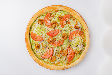 A gourmet pizza topped with shrimp, fresh herbs, and tomatoes entices flavor lovers