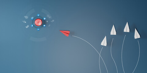 Red paper plane flying directly toward target among white planes going in different directions. Concept of leadership, strategy, innovation, goal focus, and business success. © Smile Studio AP