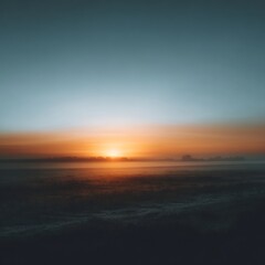 Obraz premium Tranquil Sunrise Over Quiet Landscape with Soft Hues and Mist