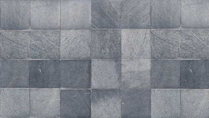 Textured gray slate tiles with a subtle linear pattern, creating a sophisticated and modern surface