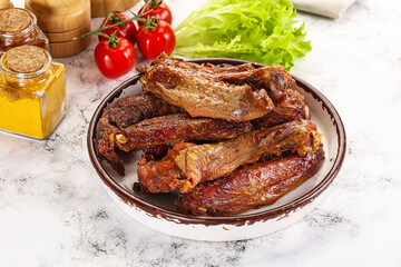 Roasted duck wings with sauce