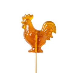 Rooster-shaped translucent caramel lollipop on a wooden stick, sweet treat