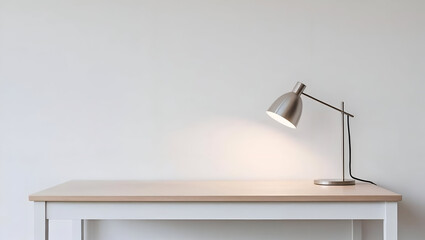 table lamp Minimalist home office or study desk scene with a modern lamp illuminating a book and a glass bottle, against a gray wall with copy space.