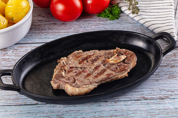 Grilled lamb steak with bone