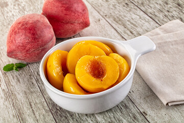 Sweet ripe yellow canned peaches