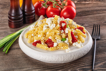 Italian pasta fusili with curd