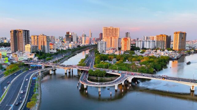Panoramic view of Saigon, Vietnam from above at Ho Chi Minh City's central business district. Cityscape and many buildings, local houses, rivers. Landscape concept.
