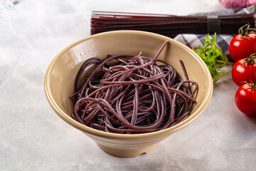 Boiled black rice noodles spaghetti