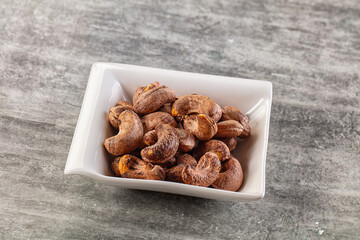 Unpeeled cashew nuts in the bowl