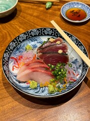 Fresh and delicate sashimi slices, beautifully presented with vibrant colors and perfect cuts. This traditional Japanese delicacy highlights the pure flavors of premium seafood.