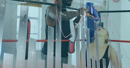 Trainer uncapping bottle, pouring water into boxer mouth to rehydrate amid scrolling finance charts - Powered by Adobe