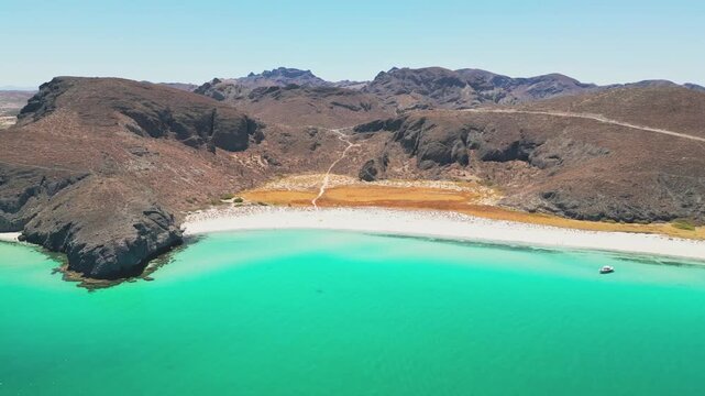 Aerial shot of Tecolote Beach in La Paz, showing turquoise waters and rocky hills