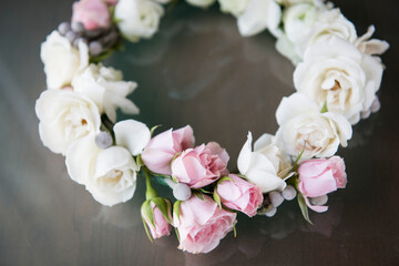 Pink and White Floral Crown with Roses on Reflective Surface