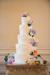 Tall Tiered Wedding Cake with Pastel Floral Accents