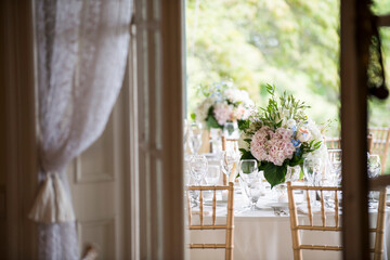Elegant Wedding Table Setting with Pastel Floral Centerpieces