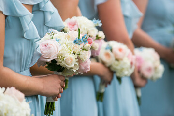 Bridesmaids Holding Pastel Bouquets in Light Blue Dresses