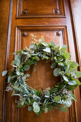 Rustic Eucalyptus and Fern Wreath on Wooden Door