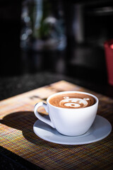Frothy Latte with Foam Art in Morning Light