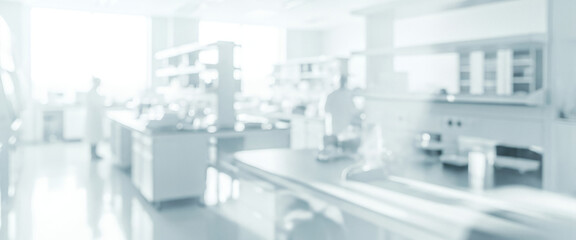Extremely blurred interior of a clinical laboratory or clean room setting, with bright white tones and indistinct shapes, ideal as a sterile background or abstract backdrop.