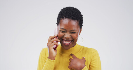 Happy, black woman and laughing with phone call in studio for humor on a white background. Female...
